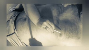 As she moans in ecstasy, he skillfully juggles a burning cigar and a delicate nipple between his teeth.